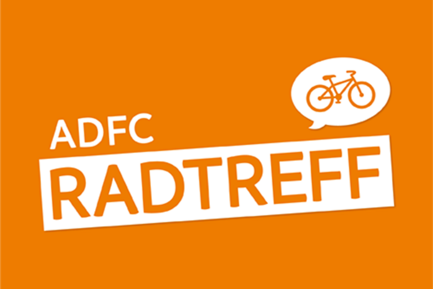 Schriftzug ADFC Radtreff auf orangefarbenen Untergrund