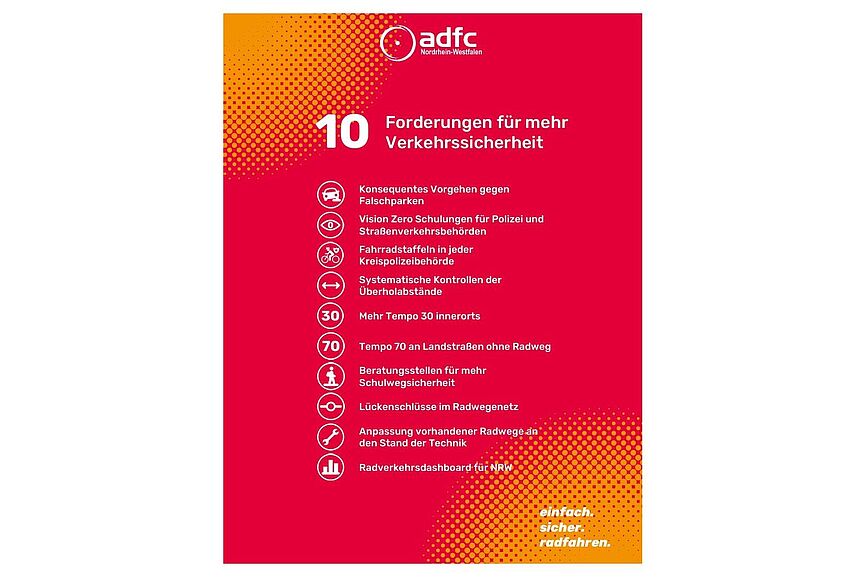 Rotes Poster mit den schriftlich aufgelisteten 10 Forderungen für mehr Verkehrssicherheit